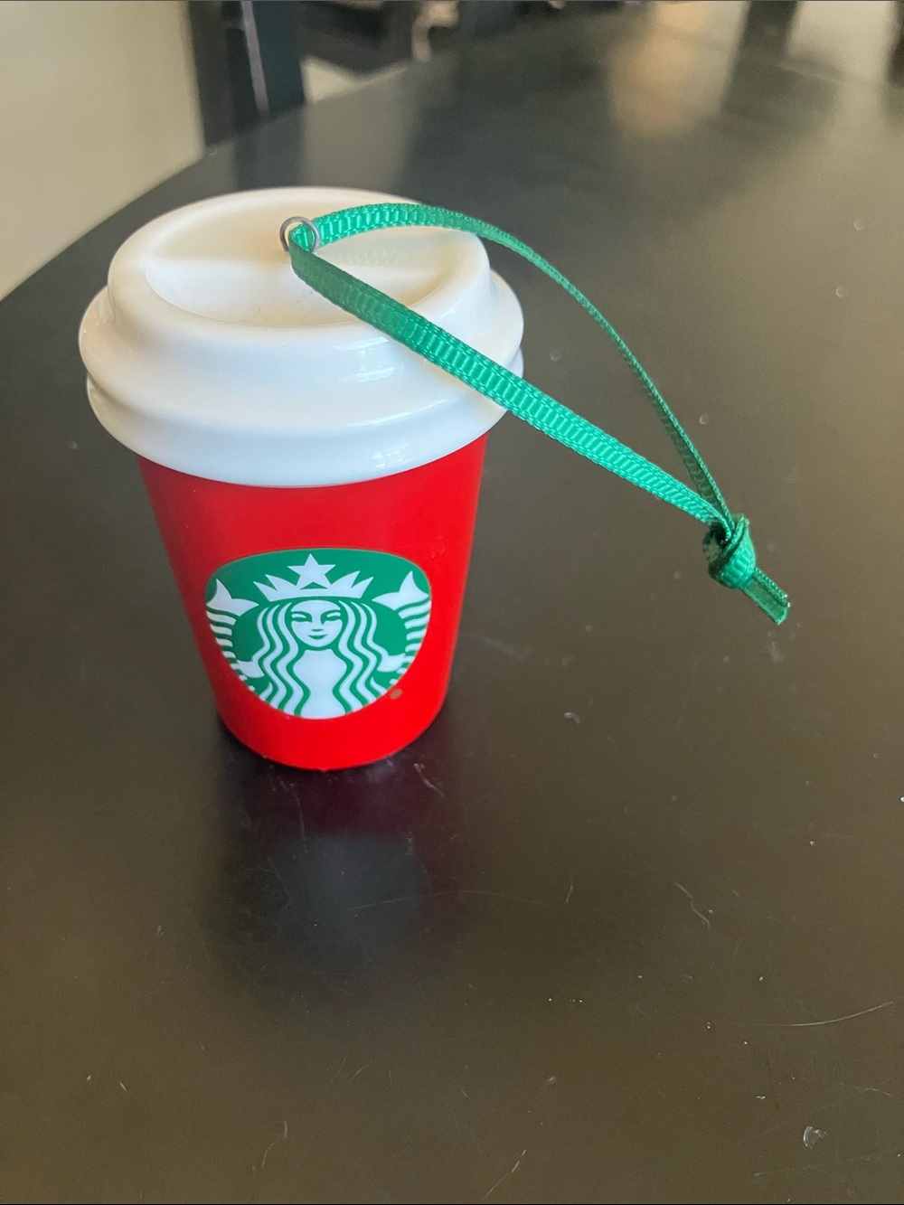 Starbucks Red Cup Ornament with White Lid and Green Ribbon